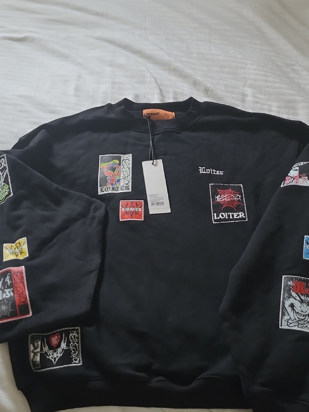 Unisex Black Crewneck Sweatshirt with Patch Graphics